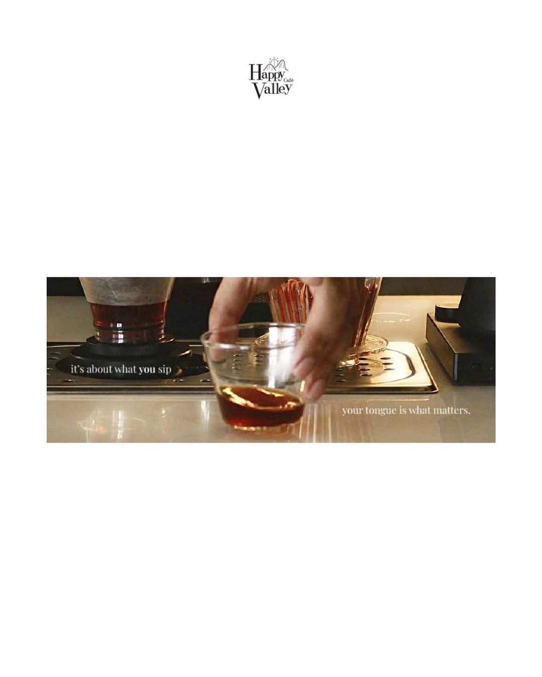 Espresso shot pulled at the bar — rich amber color in glass cup